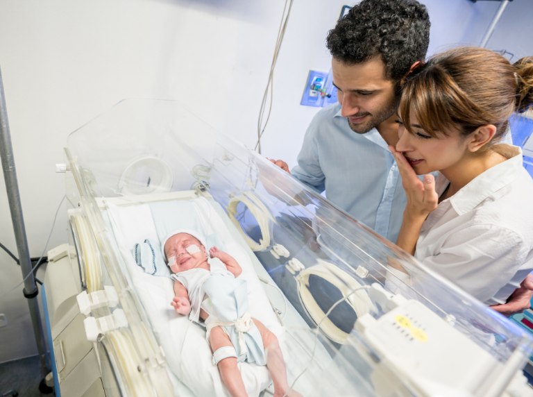 Parents at their baby's incubator