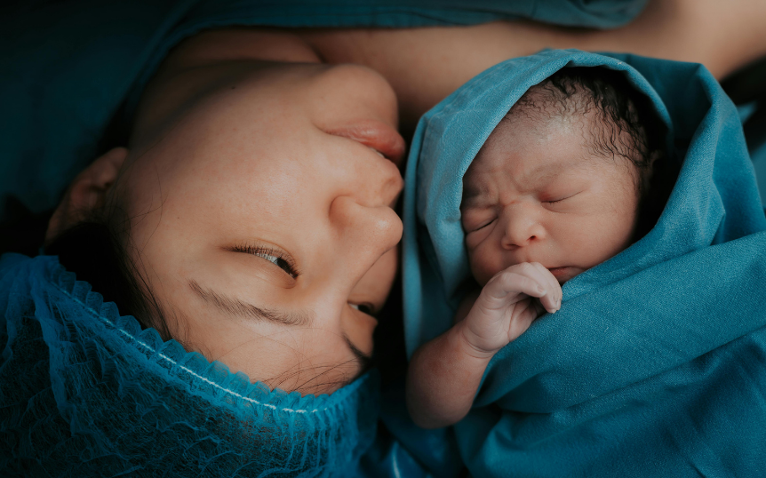 A mother holding her newborn